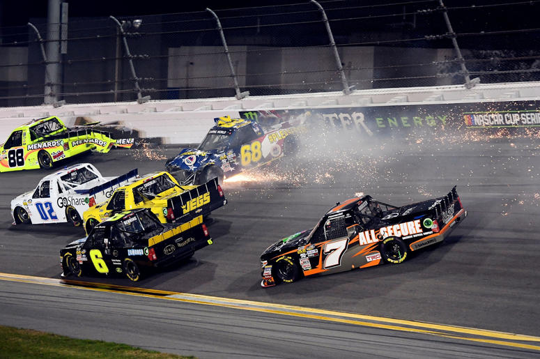 NASCAR Camping World Truck Series driver Clay Greenfield (68) wrecks into turn four with driver Matt Crafton (88) and driver Korbin Forrister (7) during the NextEra Energy Resources 250 at Daytona NASCAR Camping World Truck Series driver Clay Greenfield (68) wrecks into turn four with driver Matt Crafton (88) and driver Korbin Forrister (7) during the NextEra Energy Resources 250 at Daytona