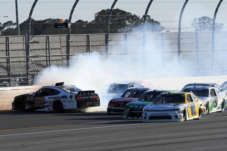 NASCAR Xfinity Series driver Aric Almirola (98) wrecks during the PowerShares QQQ 300 at Daytona International Speedway. NASCAR Xfinity Series driver Aric Almirola (98) wrecks during the PowerShares QQQ 300 at Daytona International Speedway.