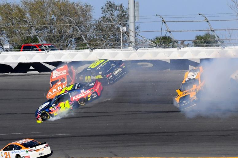 NASCAR Cup Series driver Daniel Suarez (19), Jimmie Johnson (48) , William Byron (24) and Erik Jones (20) wreck during the Daytona 500 at Daytona International Speedway. NASCAR Cup Series driver Daniel Suarez (19), Jimmie Johnson (48) , William Byron (24) and Erik Jones (20) wreck during the Daytona 500 at Daytona International Speedway.