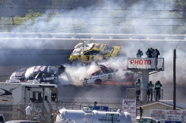 Monster Energy series drivers William Byron (21) Paul Menard (21) and Michael McDowell (34) wreck during the GEICO 500 at Talladega Superspeedway. Monster Energy series drivers William Byron (21) Paul Menard (21) and Michael McDowell (34) wreck during the GEICO 500 at Talladega Superspeedway.