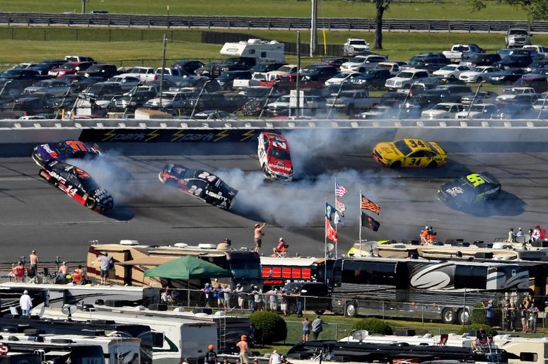 NASCAR Cup Series driver Clint Bowyer (14) wrecks in to driver Denny Hamlin (11) as driver William Bryon (24) and driver Paul Menard (27) spin during the GEICO 500 at Talladega Superspeedway. NASCAR Cup Series driver Clint Bowyer (14) wrecks in to driver Denny Hamlin (11) as driver William Bryon (24) and driver Paul Menard (27) spin during the GEICO 500 at Talladega Superspeedway.
