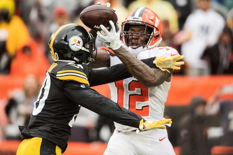 Cleveland Browns wide receiver Josh Gordon (12) catches a touchdown as Pittsburgh Steelers cornerback Cameron Sutton (20) defends during the fourth quarter at FirstEnergy Stadium. Cleveland Browns wide receiver Josh Gordon (12) catches a touchdown as Pittsburgh Steelers cornerback Cameron Sutton (20) defends during the fourth quarter at FirstEnergy Stadium.