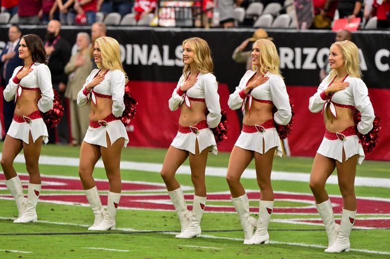Arizona Cardinals cheerleaders look on during the National Anthem prior to the game against the San Francisco 49ers at State Farm Stadium. Arizona Cardinals cheerleaders look on during the National Anthem prior to the game against the San Francisco 49ers at State Farm Stadium.