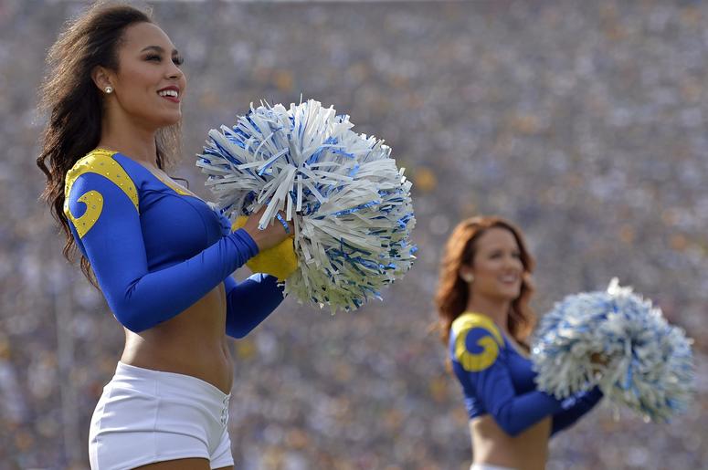 Los Angeles Rams cheerleaders look on during the second quarter against the Green Bay Packers at Los Angeles Memorial Coliseum. Los Angeles Rams cheerleaders look on during the second quarter against the Green Bay Packers at Los Angeles Memorial Coliseum.