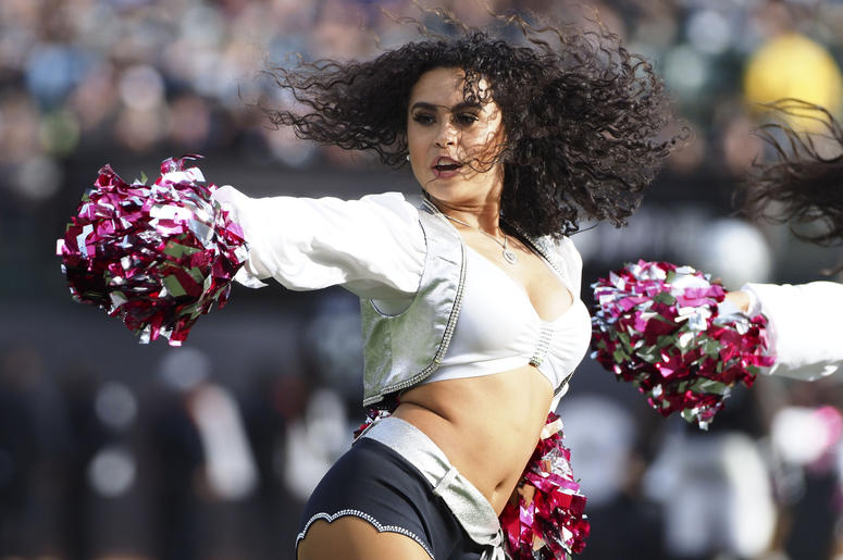Oakland Raiders cheerleader performs during a timeout against the Indianapolis Colts during the fourth quarter at Oakland Coliseum. Oakland Raiders cheerleader performs during a timeout against the Indianapolis Colts during the fourth quarter at Oakland Coliseum.