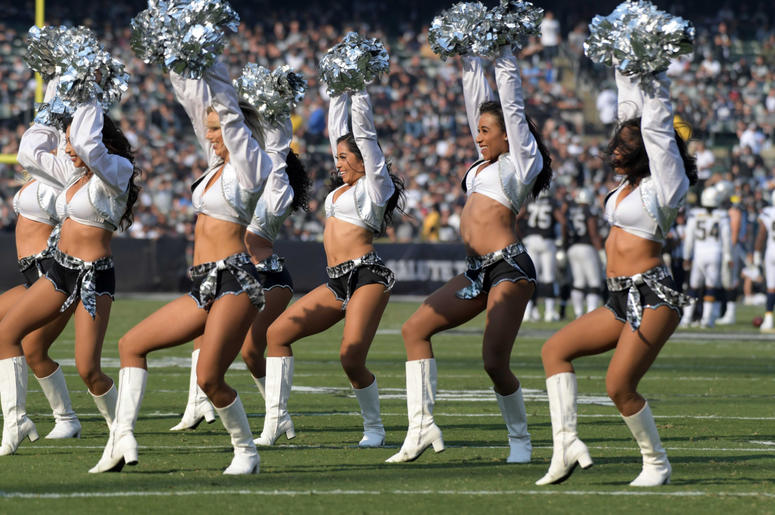 Oakland Raiders raiderette cheerleaders dance during the game against the Los Angeles Chargers at Oakland Coliseum. Oakland Raiders raiderette cheerleaders dance during the game against the Los Angeles Chargers at Oakland Coliseum.