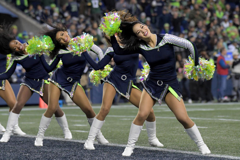 Seattle Seahawks cheerleaders perform against the Green Bay Packers during the first half at CenturyLink Field. Seattle Seahawks cheerleaders perform against the Green Bay Packers during the first half at CenturyLink Field.