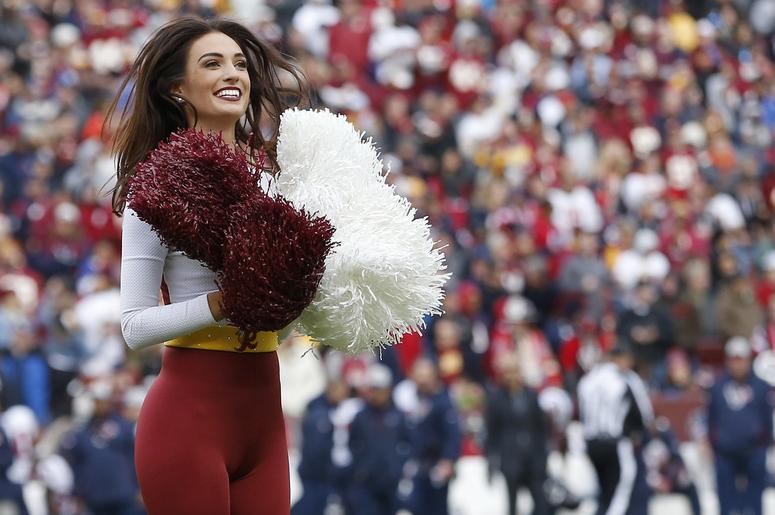 Washington Redskins cheerleader dances on the field during a timeout against the Houston Texans in the third quarter at FedEx Field. Washington Redskins cheerleader dances on the field during a timeout against the Houston Texans in the third quarter at FedEx Field.