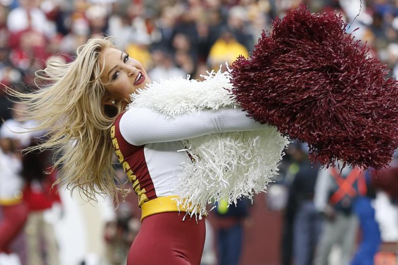 A Washington Redskins cheerleader dances on the field during a timeout against the Houston Texans in the third quarter at FedEx Field. A Washington Redskins cheerleader dances on the field during a timeout against the Houston Texans in the third quarter at FedEx Field.