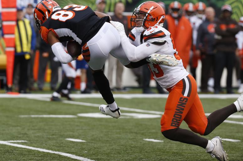 incinnati Bengals wide receiver Tyler Boyd (83) catches a pass against Cleveland Browns middle linebacker Joe Schobert (53) during the second half at Paul Brown Stadium. incinnati Bengals wide receiver Tyler Boyd (83) catches a pass against Cleveland Browns middle linebacker Joe Schobert (53) during the second half at Paul Brown Stadium.