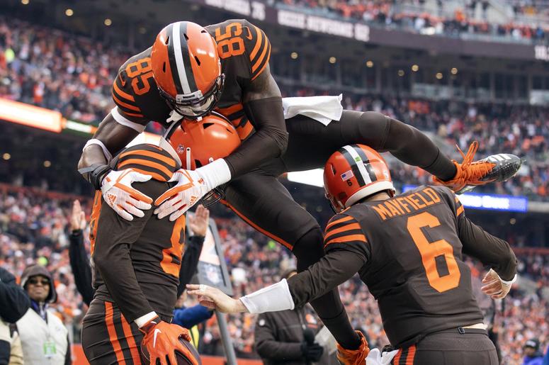Cleveland Browns tight end Darren Fells (88) gets congratulated by quarterback Baker Mayfield (6) as tight end David Njoku (85) jumps on top of them during the second quarter against the Cincinnati Bengals at FirstEnergy Stadium. Cleveland Browns tight end Darren Fells (88) gets congratulated by quarterback Baker Mayfield (6) as tight end David Njoku (85) jumps on top of them during the second quarter against the Cincinnati Bengals at FirstEnergy Stadium.