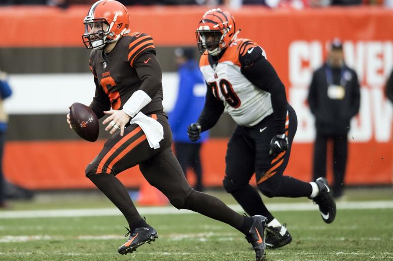Cleveland Browns quarterback Baker Mayfield (6) scrambles as Cincinnati Bengals defensive end Christian Ringo (79) pursues during the second half at FirstEnergy Stadium. Cleveland Browns quarterback Baker Mayfield (6) scrambles as Cincinnati Bengals defensive end Christian Ringo (79) pursues during the second half at FirstEnergy Stadium.
