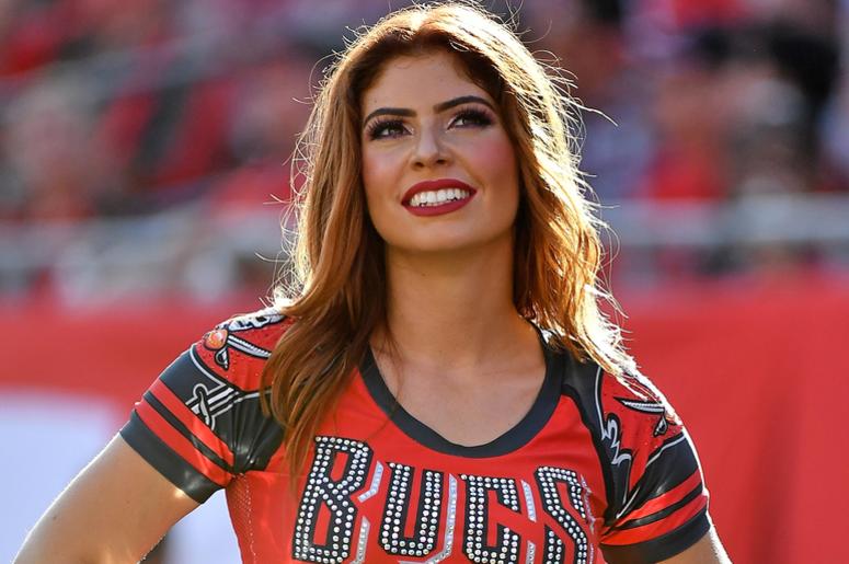 A Tampa Bay Buccaneers cheerleader poses during the second half between the Tampa Bay Buccaneers and the Atlanta Falcons at Raymond James Stadium. A Tampa Bay Buccaneers cheerleader poses during the second half between the Tampa Bay Buccaneers and the Atlanta Falcons at Raymond James Stadium.