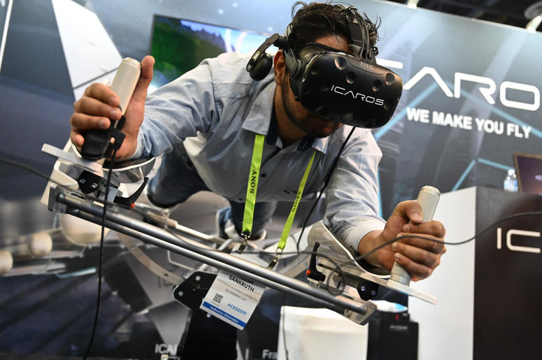 Jan 9, 2019; Las Vegas, NV; Aneesh Sankruth tries out the Icaros Pro during the Consumer Electronics Show 2019 at the Sands Expo Convention Center. Icaros says their products \"Combines fitness with virtual reality and enables users to fly, dive or drive Jan 9, 2019; Las Vegas, NV; Aneesh Sankruth tries out the Icaros Pro during the Consumer Electronics Show 2019 at the Sands Expo Convention Center. Icaros says their products \"Combines fitness with virtual reality and enables users to fly, dive or drive