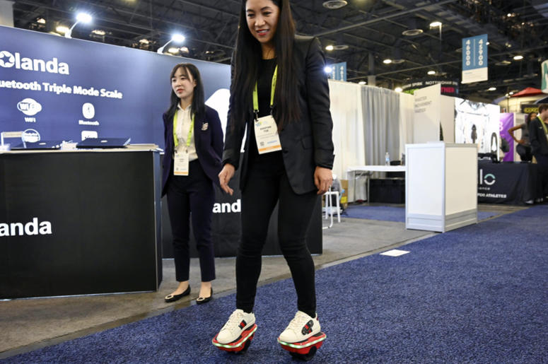 January 8, 2019; Las Vegas, NV, USA; Xiaoyan Yue rides Glare Technology's Hover Shoes during the Consumer Electronics Show 2019 in the Sands Expo Convention Center. The company distributes various hover products including skateboards and scooters. January 8, 2019; Las Vegas, NV, USA; Xiaoyan Yue rides Glare Technology's Hover Shoes during the Consumer Electronics Show 2019 in the Sands Expo Convention Center. The company distributes various hover products including skateboards and scooters.