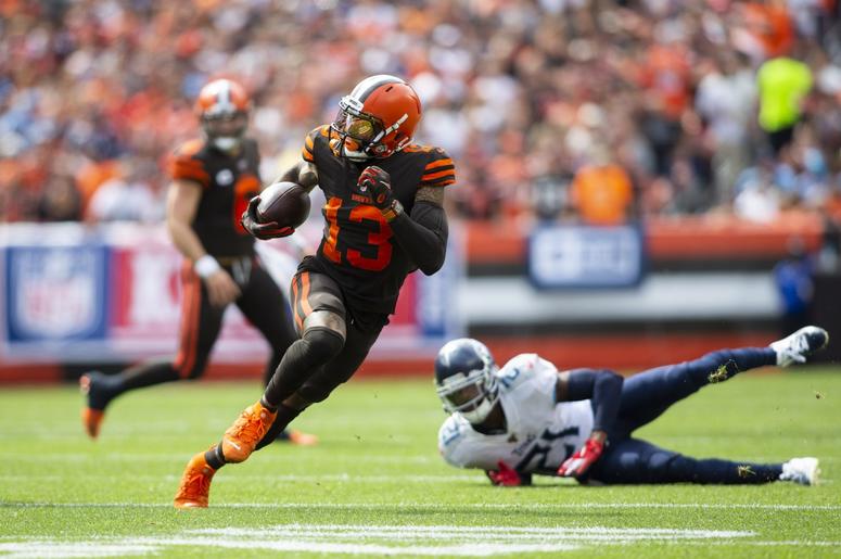 Cleveland Browns wide receiver Odell Beckham (13) runs the ball past Tennessee Titans cornerback Malcolm Butler (21) during the first quarter at FirstEnergy Stadium. Cleveland Browns wide receiver Odell Beckham (13) runs the ball past Tennessee Titans cornerback Malcolm Butler (21) during the first quarter at FirstEnergy Stadium.