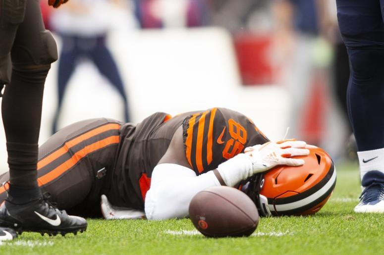 Cleveland Browns tight end David Njoku (85) lays on the ground following a hit to the head by the Tennessee Titans during the second quarter at FirstEnergy Stadium. Cleveland Browns tight end David Njoku (85) lays on the ground following a hit to the head by the Tennessee Titans during the second quarter at FirstEnergy Stadium.
