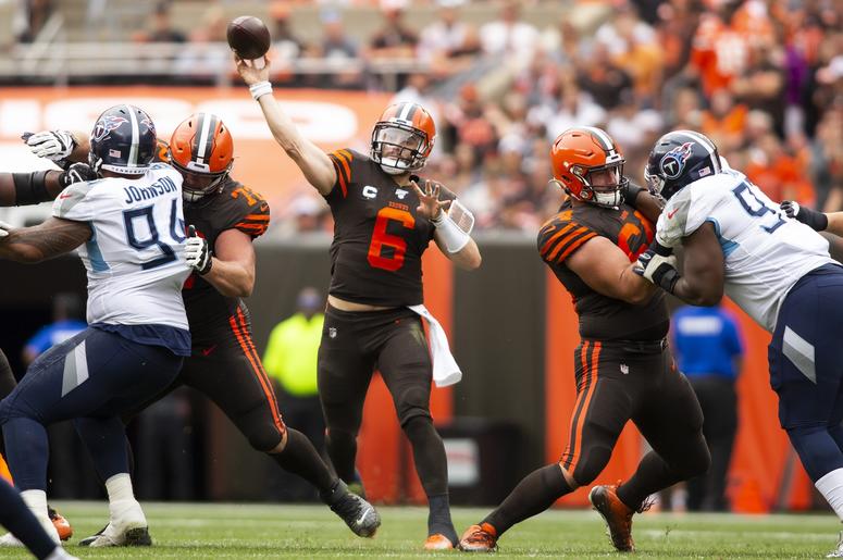 Cleveland Browns quarterback Baker Mayfield (6) throws the ball for a first down against the Tennessee Titans during the third quarter at FirstEnergy Stadium. Cleveland Browns quarterback Baker Mayfield (6) throws the ball for a first down against the Tennessee Titans during the third quarter at FirstEnergy Stadium.