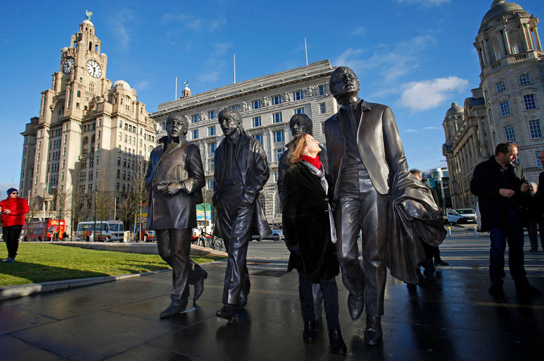 A new statue of the Beatles is unveiled by John Lennon's sister Julia Baird (centre) outside the Liverbuilding, in Liverpool. A new statue of the Beatles is unveiled by John Lennon's sister Julia Baird (centre) outside the Liverbuilding, in Liverpool.
