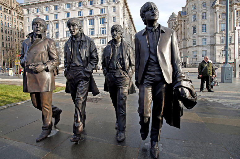 A new statue of the Beatles is unveiled by John Lennon's sister Julia Baird (not pictured) outside the Liverbuilding, in Liverpool. A new statue of the Beatles is unveiled by John Lennon's sister Julia Baird (not pictured) outside the Liverbuilding, in Liverpool.