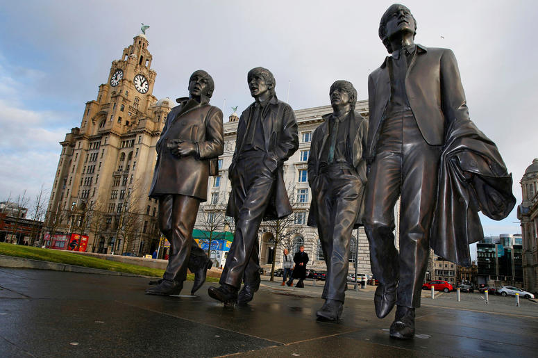 A new statue of the Beatles is unveiled by John Lennon's sister Julia Baird (not pictured) outside the Liverbuilding, in Liverpool. A new statue of the Beatles is unveiled by John Lennon's sister Julia Baird (not pictured) outside the Liverbuilding, in Liverpool.