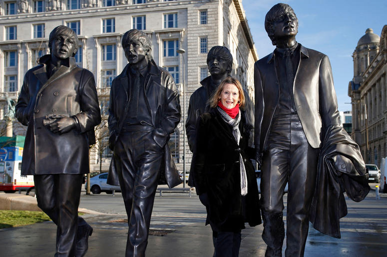 A new statue of the Beatles is unveiled by John Lennon's sister Julia Baird outside the Liverbuilding, in Liverpool. A new statue of the Beatles is unveiled by John Lennon's sister Julia Baird outside the Liverbuilding, in Liverpool.