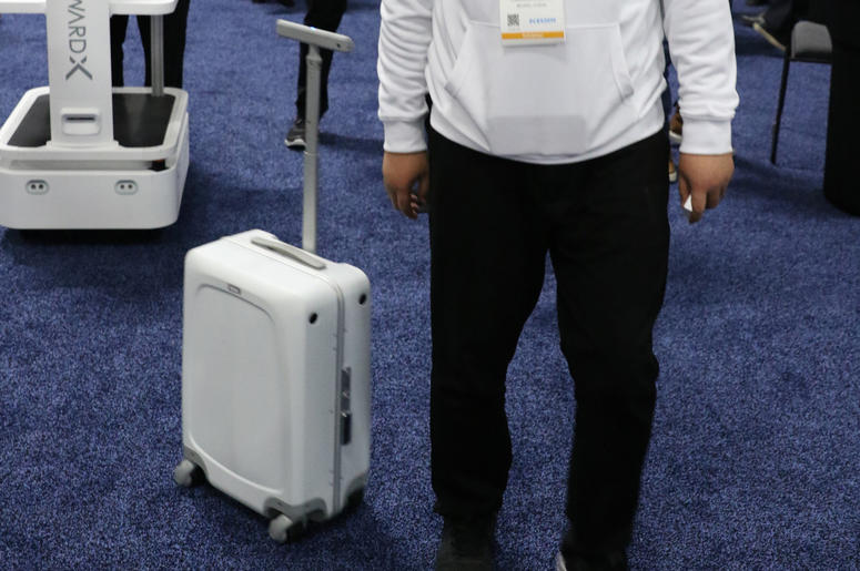 Zhaoqiang Chen of ForwardX Robotics demonstrates how ForwardX CX-1, an autonomous piece of luggage that's designed to follow people around as they make their way from point A to B, used at Unveiled Las Vegas, the 2019 Consumer Electronics Show (CES) media Zhaoqiang Chen of ForwardX Robotics demonstrates how ForwardX CX-1, an autonomous piece of luggage that's designed to follow people around as they make their way from point A to B, used at Unveiled Las Vegas, the 2019 Consumer Electronics Show (CES) media