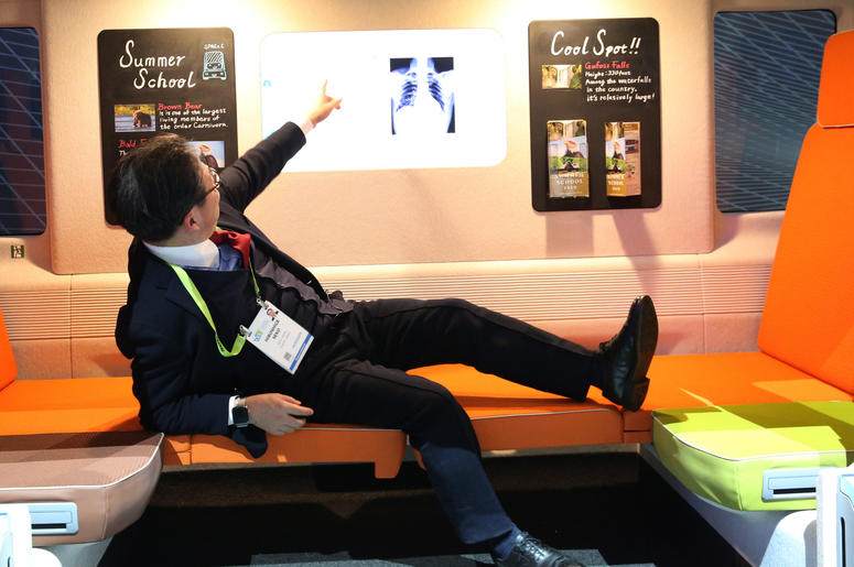 Minister of Economy of Japan, Hiroshige Sekō, points to his x-ray after his health exam inside Space_C Autonomous e-mobility vehicle during the 2019 Consumer Electronics Show (CES) at the Las Vegas Convention Center on Tuesday, Jan. 8, 2019, in Las Vegas, Minister of Economy of Japan, Hiroshige Sekō, points to his x-ray after his health exam inside Space_C Autonomous e-mobility vehicle during the 2019 Consumer Electronics Show (CES) at the Las Vegas Convention Center on Tuesday, Jan. 8, 2019, in Las Vegas,
