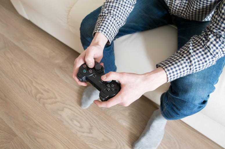 young man playing video games young man playing video games