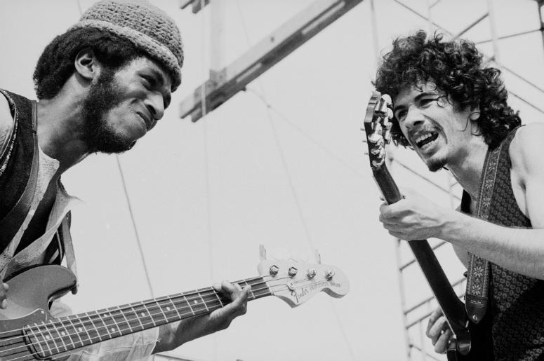 Carlos Santana (right) and David Brown perform with the other members of Santana at Woodstock Carlos Santana (right) and David Brown perform with the other members of Santana at Woodstock