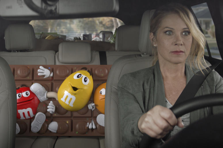 This undated image provided by M&M’S shows a scene from the company's 2019 Super Bowl NFL football spot starring Christina Applegate. M&M’s enlisted actress Christina Applegate for its spot. (M&M’S via AP) This undated image provided by M&M’S shows a scene from the company's 2019 Super Bowl NFL football spot starring Christina Applegate. M&M’s enlisted actress Christina Applegate for its spot. (M&M’S via AP)