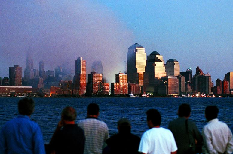 People watch smoke emit from the former site of the World Trade Center September 12, 2001 in Hoboken, N.J. Smoke filled the air all over lower Manhattan in the aftermath of Tuesday's terrorist attack and destruction of the World Trade Center. (Photo by Ch People watch smoke emit from the former site of the World Trade Center September 12, 2001 in Hoboken, N.J. Smoke filled the air all over lower Manhattan in the aftermath of Tuesday's terrorist attack and destruction of the World Trade Center. (Photo by Ch
