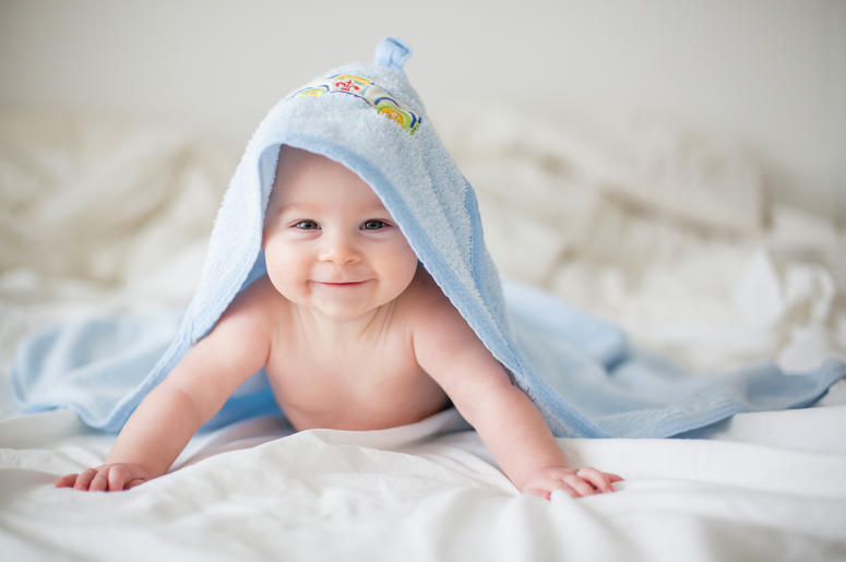 Cute little baby boy, relaxing in bed after bath, smiling happily Cute little baby boy, relaxing in bed after bath, smiling happily, daytime Cute little baby boy, relaxing in bed after bath, smiling happily Cute little baby boy, relaxing in bed after bath, smiling happily, daytime