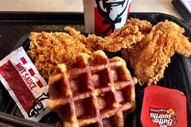 KFC's new chicken and waffle comes with a small, thick, Belgian-style waffle, two pieces of chicken and syrup. Ask for hot sauce on the side for something closer to the real chicken and waffle experience. Kathleen Purvis/Charlotte Observer/TNS/Sipa USA) KFC's new chicken and waffle comes with a small, thick, Belgian-style waffle, two pieces of chicken and syrup. Ask for hot sauce on the side for something closer to the real chicken and waffle experience. Kathleen Purvis/Charlotte Observer/TNS/Sipa USA)