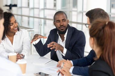 Boss Talking At Table man talking at table in office