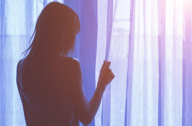 Woman By Window