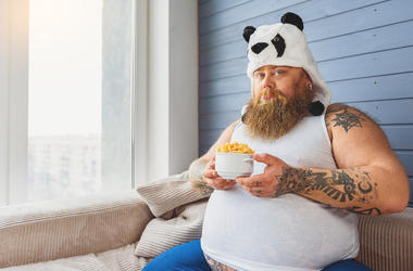 Sad Fat Guy In A Panda Hat sad fat guy in panda hat with bowl of corn puffs