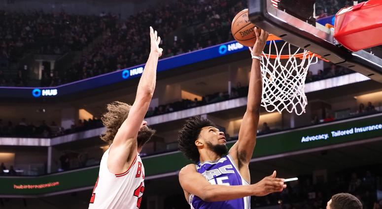 Kings forward Marvin Bagley III (35) scores a layup against Bulls center Robin Lopez (42). Kings forward Marvin Bagley III (35) scores a layup against Bulls center Robin Lopez (42).