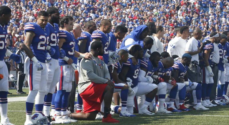 Bills players kneel in protest during the national anthem before a game. Bills players kneel in protest during the national anthem before a game.