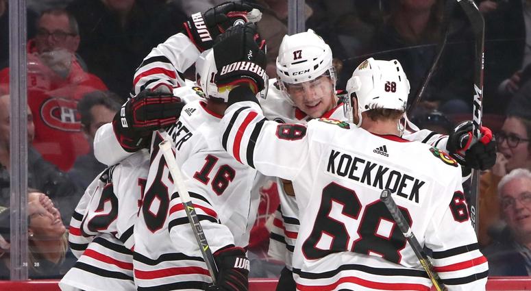 Blackhawks defenseman Connor Murphy (5) celebrates his goal against the Canadiens with teammates. Blackhawks defenseman Connor Murphy (5) celebrates his goal against the Canadiens with teammates.