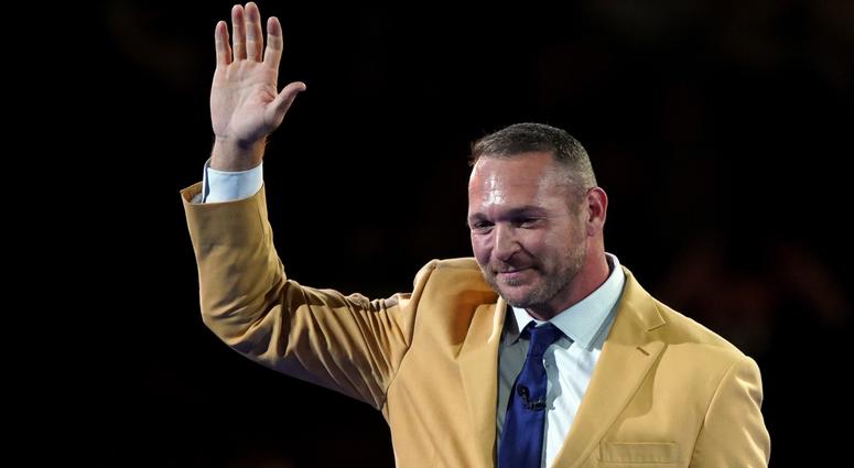 Brian Urlacher waves at the Hall of Fame festivities. Brian Urlacher waves at the Hall of Fame festivities.