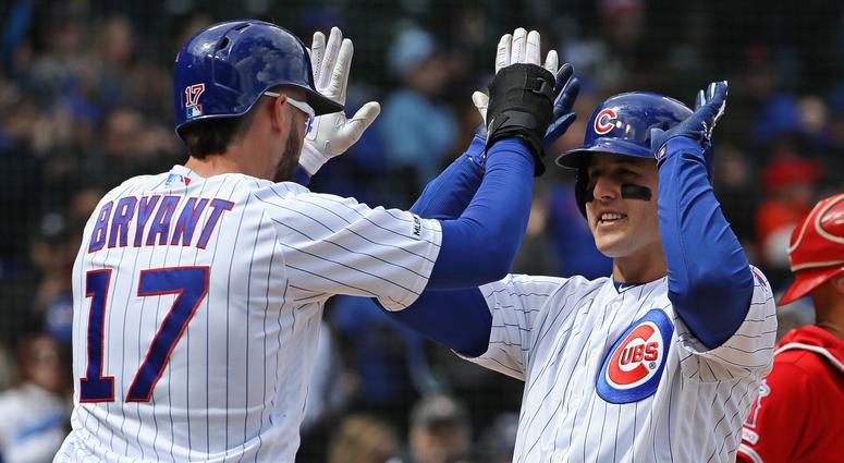Kris Bryant (17) congratulates Cubs teammate Anthony Rizzo after Rizzo homered. Kris Bryant (17) congratulates Cubs teammate Anthony Rizzo after Rizzo homered.