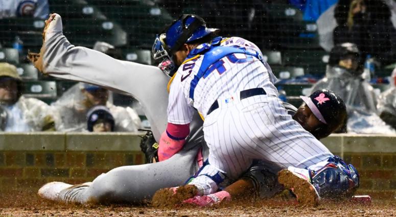 Cubs catcher Willson Contreras (40) tags out Brewers first baseman Jesus Aguilar (24). Cubs catcher Willson Contreras (40) tags out Brewers first baseman Jesus Aguilar (24).