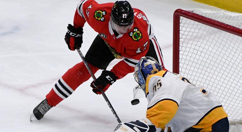 Predators goalie Pekka Rinne (35) defends against Blackhawks center Dylan Strome (17). Predators goalie Pekka Rinne (35) defends against Blackhawks center Dylan Strome (17).