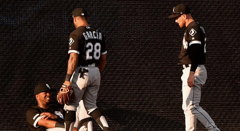 Eloy Jimenez, left, reacts after colliding with White Sox teammate Charlie Tilson. Eloy Jimenez, left, reacts after colliding with White Sox teammate Charlie Tilson.