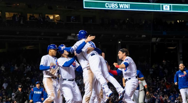 Cubs shortstop Javier Baez (9) celebrates his walk-off single against the Phillies with teammates. Cubs shortstop Javier Baez (9) celebrates his walk-off single against the Phillies with teammates.