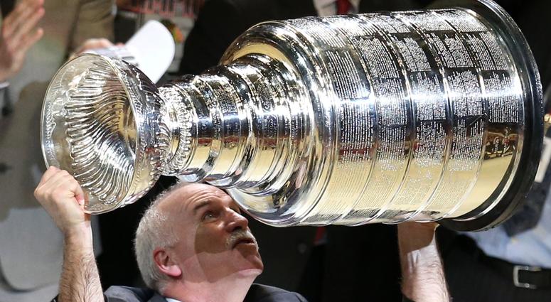 Joel Quenneville hoists the Stanley Cup after the Blackhawks won the championship in 2015. Joel Quenneville hoists the Stanley Cup after the Blackhawks won the championship in 2015.