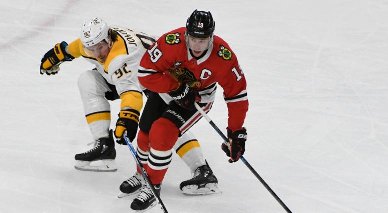 Blackhawks center Jonathan Toews (19) and Predators center Ryan Johansen (92) battle the puck. Blackhawks center Jonathan Toews (19) and Predators center Ryan Johansen (92) battle the puck.