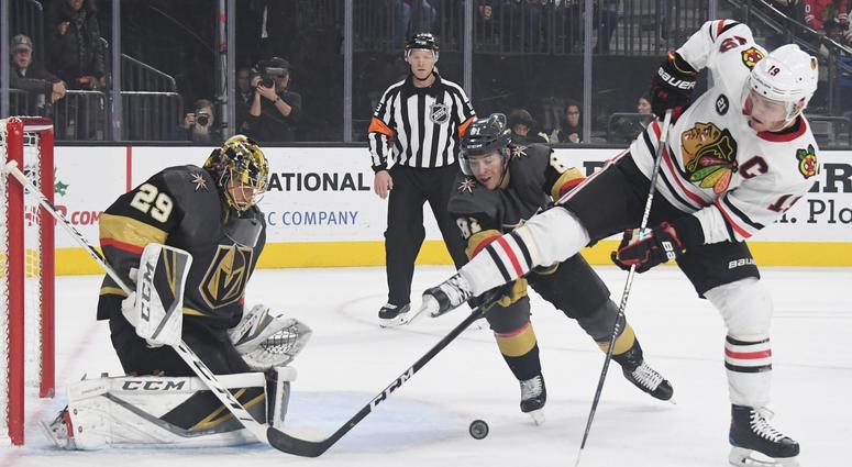 Knights goalie Marc-Andre Fleury blocks a shot by Blackhawks center Jonathan Toews (19). Knights goalie Marc-Andre Fleury blocks a shot by Blackhawks center Jonathan Toews (19).