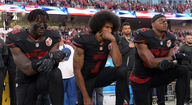 49ers outside linebacker Eli Harold (58), quarterback Colin Kaepernick (7) and safety Eric Reid (35) kneel in protest during the national anthem before a game in 2016. 49ers outside linebacker Eli Harold (58), quarterback Colin Kaepernick (7) and safety Eric Reid (35) kneel in protest during the national anthem before a game in 2016.
